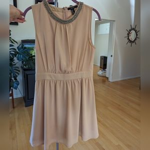 Beautiful cream colored flowy dress with beaded neckline